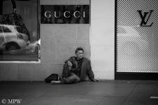 poor man outside Aucklands most exclusive shops
